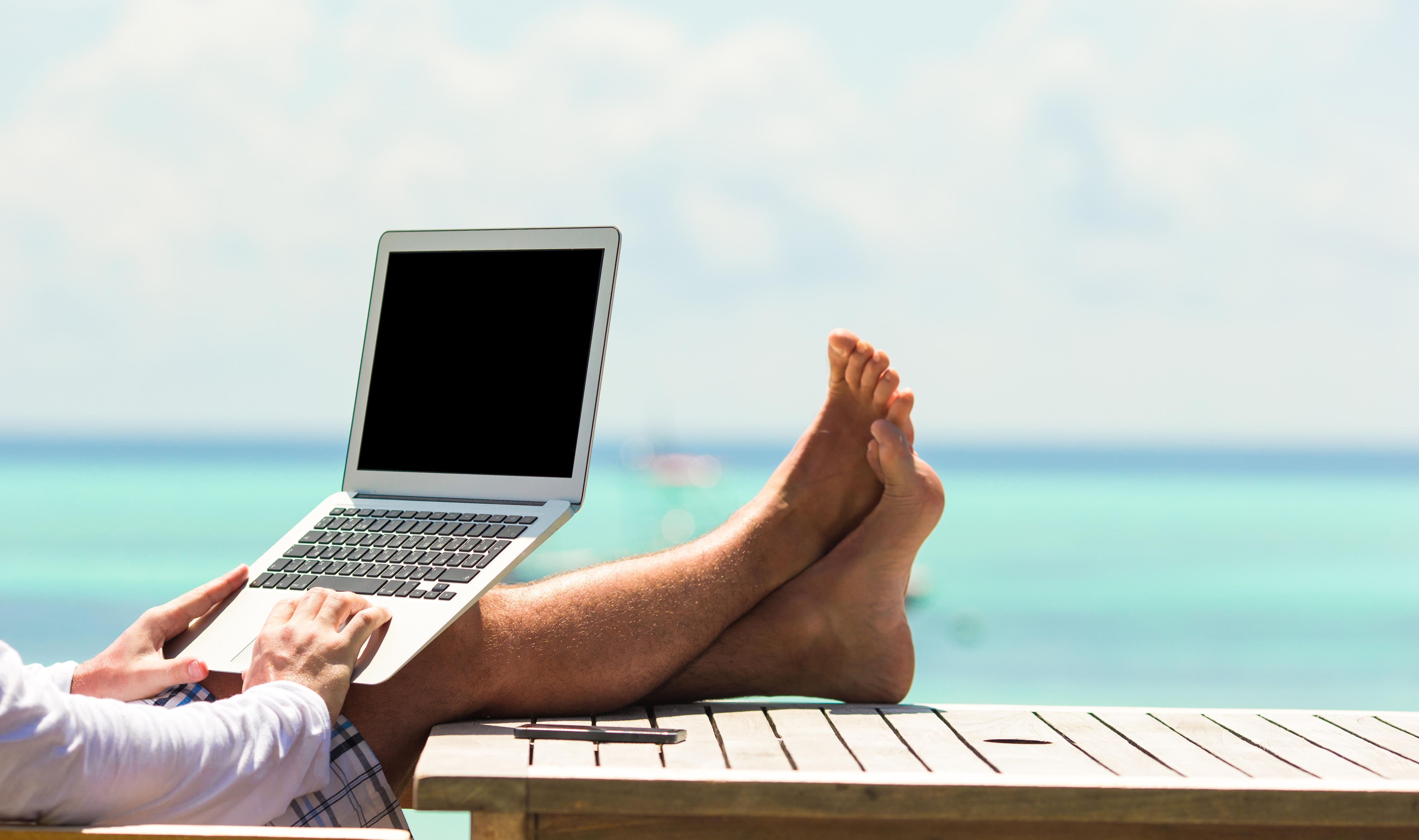 A digital nomad working at the beach
